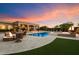 Stunning backyard oasis with a sparkling pool, spa, fire pit, and lush landscaping at 22610 N 80Th Pl, Scottsdale, AZ 85255
