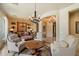 Sitting area with comfortable seating, chandelier and views into another room at 22610 N 80Th Pl, Scottsdale, AZ 85255