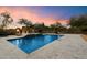Swimming pool with a spa, set amidst an oasis of lush vegetation, mature trees, and fire features at 22610 N 80Th Pl, Scottsdale, AZ 85255