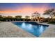 Expansive backyard pool with a spa, lounge chairs, fire features, and views of desert flora and fauna at 22610 N 80Th Pl, Scottsdale, AZ 85255