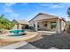 Backyard pool and patio area surrounded by rock and desert landscaping at 2272 W Jasper Butte Dr, Queen Creek, AZ 85144