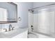 Bathroom with vanity, mirror, shower-tub combination, and tiled walls at 2272 W Jasper Butte Dr, Queen Creek, AZ 85144