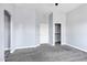 Open bedroom with neutral colored carpet, baseboards, and a closet at 2272 W Jasper Butte Dr, Queen Creek, AZ 85144