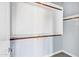 Spacious walk-in closet offering ample storage with shelving and wooden rods at 2272 W Jasper Butte Dr, Queen Creek, AZ 85144