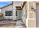 Inviting front entrance with security screen door and well-manicured landscaping at 2272 W Jasper Butte Dr, Queen Creek, AZ 85144