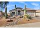 Beautifully landscaped front yard with desert plants and rock accents at 2272 W Jasper Butte Dr, Queen Creek, AZ 85144