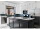 Modern kitchen features stainless steel appliances, granite counters, island and white cabinets at 2272 W Jasper Butte Dr, Queen Creek, AZ 85144