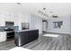 Open kitchen layout with stainless appliances, ample countertop space, and stylish lighting at 2272 W Jasper Butte Dr, Queen Creek, AZ 85144