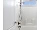 Bright, updated shower with bronze fixtures and white tiling to ceiling at 2272 W Jasper Butte Dr, Queen Creek, AZ 85144