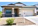 Inviting single-story home with a two-car garage and well-maintained desert landscaping in the front yard at 2745 W Jessica Ln, Phoenix, AZ 85041