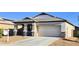 Charming single-story home featuring stone accents, a two-car garage, and a well-manicured front yard at 2745 W Jessica Ln, Phoenix, AZ 85041