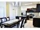Charming kitchen featuring granite countertops, stainless appliances, island, chandelier, and breakfast area at 2745 W Jessica Ln, Phoenix, AZ 85041