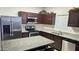Modern kitchen with stainless steel appliances, granite countertops, and ample cabinet space at 2745 W Jessica Ln, Phoenix, AZ 85041