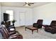 Bright living area with comfortable seating, ceiling fan, and neutral carpet at 2745 W Jessica Ln, Phoenix, AZ 85041