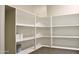 Spacious pantry with ample white shelving for organized storage, perfect for any home cook at 2745 W Jessica Ln, Phoenix, AZ 85041