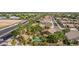Beautiful aerial view of home in neighborhood with a lush backyard, pool and palm trees at 30 W Sheffield Ave, Gilbert, AZ 85233