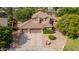 Expansive aerial view of a two-story home with a three-car garage, mature trees, and well-maintained landscaping at 30 W Sheffield Ave, Gilbert, AZ 85233