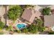 Aerial shot showcases a private backyard with a custom pool, patio and mature landscaping at 30 W Sheffield Ave, Gilbert, AZ 85233