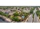 Overhead shot of a landscaped yard featuring sparkling pool, BBQ, palm trees, and fenced yard at 30 W Sheffield Ave, Gilbert, AZ 85233