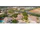Mature trees surround this home with three car garage, tile roof, and manicured front lawn at 30 W Sheffield Ave, Gilbert, AZ 85233