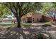 Lush backyard featuring a covered patio and a tranquil pool area perfect for relaxing and entertaining at 30 W Sheffield Ave, Gilbert, AZ 85233
