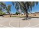 Outdoor basketball court surrounded by mature trees and landscaping at 30 W Sheffield Ave, Gilbert, AZ 85233