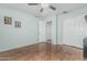 Neutral-toned bedroom with a ceiling fan and vinyl flooring at 30 W Sheffield Ave, Gilbert, AZ 85233
