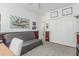 This bedroom offers a comfortable futon and access to ample closet space at 30 W Sheffield Ave, Gilbert, AZ 85233