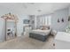 Stylish bedroom featuring a modern bed, comfortable desk and mirror, and shutters on the window at 30 W Sheffield Ave, Gilbert, AZ 85233