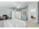 Spacious bedroom with high ceilings, ceiling fan, and ensuite bathroom with a bathtub at 30 W Sheffield Ave, Gilbert, AZ 85233