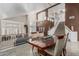Elegant dining room with a view of the living room, staircase, and neutral décor at 30 W Sheffield Ave, Gilbert, AZ 85233