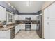Modern kitchen featuring stainless steel appliances, white cabinetry, and patterned backsplash at 30 W Sheffield Ave, Gilbert, AZ 85233