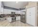 Well-equipped kitchen with stainless steel appliances, granite countertops, and ample cabinet space at 30 W Sheffield Ave, Gilbert, AZ 85233