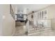 Bright living room with a large TV, neutral carpet, and convenient access from the adjacent staircase at 30 W Sheffield Ave, Gilbert, AZ 85233