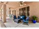 Covered patio featuring a ceiling fan, dark wicker furniture and decorative pot at 30 W Sheffield Ave, Gilbert, AZ 85233