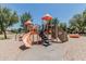 A playground with colorful slides, climbing walls, and various play structures, offering a fun and engaging space at 30 W Sheffield Ave, Gilbert, AZ 85233