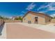 Backyard view showcasing a patio, block fence, and desert landscaping at 3035 W Roberta Dr, Phoenix, AZ 85083