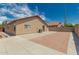 Backyard view showcasing a patio, block fence, and desert landscaping at 3035 W Roberta Dr, Phoenix, AZ 85083
