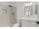 Bathroom featuring modern shower with tiled walls, rain shower head, and a vanity at 3035 W Roberta Dr, Phoenix, AZ 85083