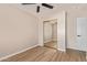 Bedroom featuring mirrored closet doors, and a ceiling fan at 3035 W Roberta Dr, Phoenix, AZ 85083