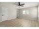 Bright bedroom featuring neutral walls, wood flooring, and a window providing natural light at 3035 W Roberta Dr, Phoenix, AZ 85083