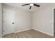 A well-lit bedroom featuring neutral walls and a modern ceiling fan at 3035 W Roberta Dr, Phoenix, AZ 85083