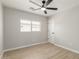 Bedroom with a window, ceiling fan, and neutral-colored walls at 3035 W Roberta Dr, Phoenix, AZ 85083