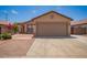 Charming single-story home featuring a two-car garage, low maintenance landscaping, and a welcoming facade at 3035 W Roberta Dr, Phoenix, AZ 85083