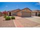 Charming home with desert landscaping, brick accents and a two car garage on a sunny day at 3035 W Roberta Dr, Phoenix, AZ 85083