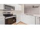 Modern kitchen with stainless steel appliances, white cabinets, and a bright, clean aesthetic at 3035 W Roberta Dr, Phoenix, AZ 85083