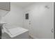 A brightly lit laundry room with a door and washer and dryer at 3035 W Roberta Dr, Phoenix, AZ 85083