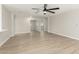 Bright and open living space showcasing modern lighting, neutral walls, and wood-look flooring at 3035 W Roberta Dr, Phoenix, AZ 85083