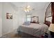 Bedroom with a four poster bed, neutral walls, closet and ceiling fan at 3085 E Parkview Dr, Gilbert, AZ 85295