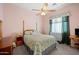 Relaxing bedroom with a ceiling fan and decorative furniture, creating a comfortable atmosphere at 3085 E Parkview Dr, Gilbert, AZ 85295